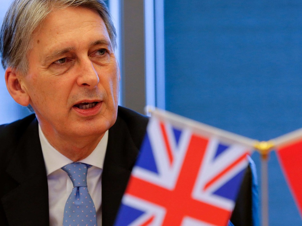 英国新任财政大臣哈蒙德于7月22日首次访问中国