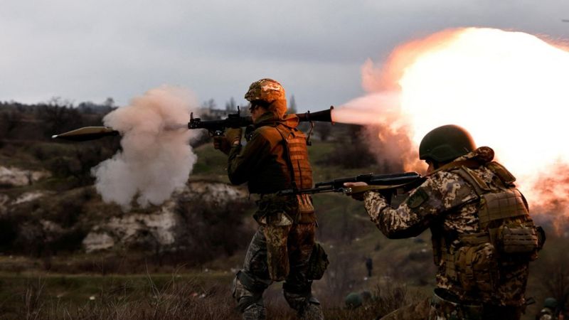 New Ukrainian army brigade recruits take part in a military exercise conducted by a foreign instruct ...